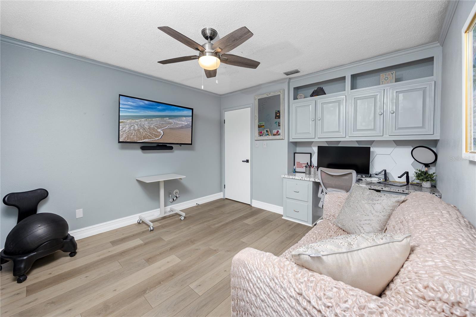 Office with built-in cabinetry and desk area