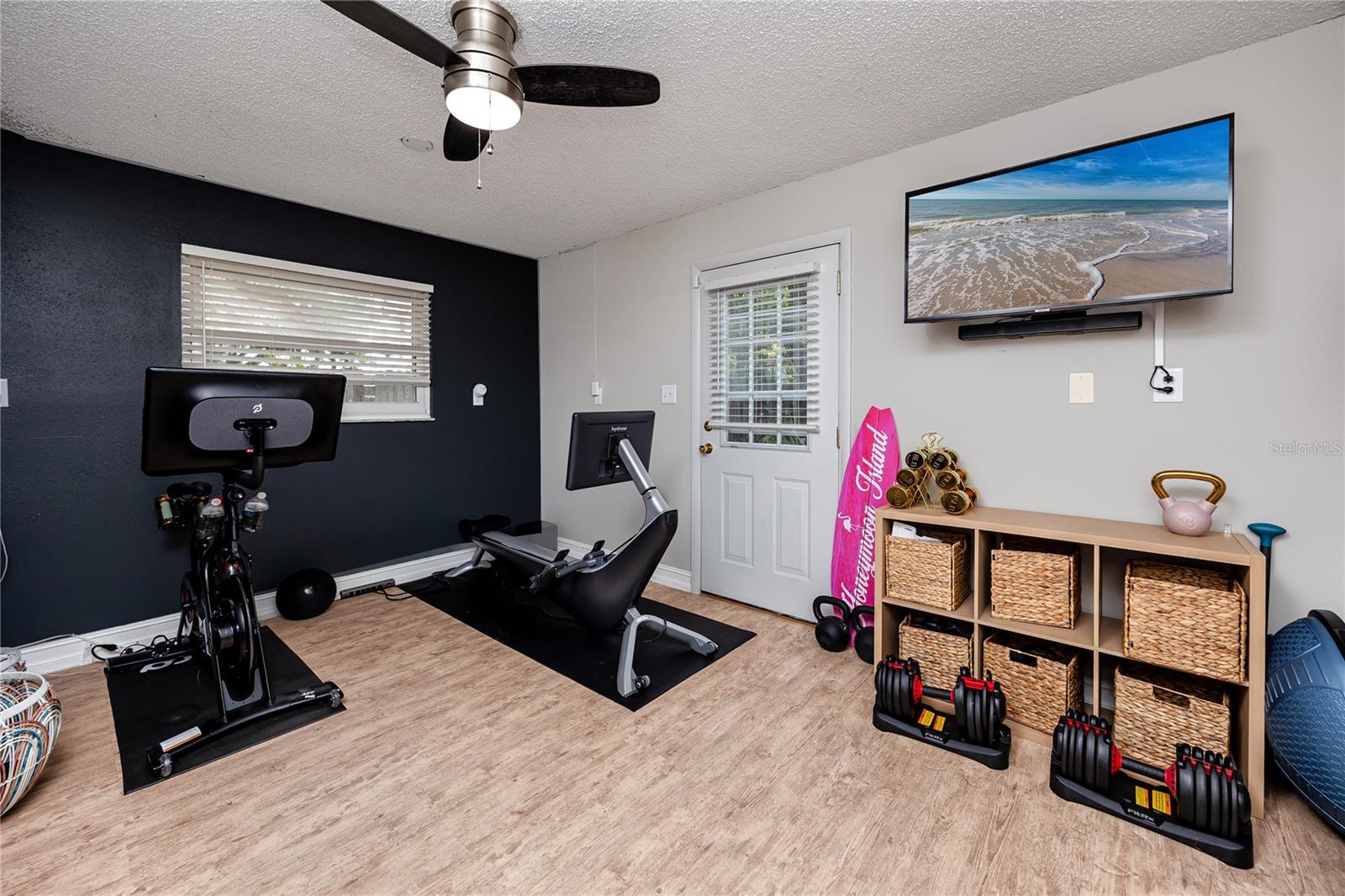 Bonus room off the pool currently used as a gym, but has lots of possibilities.