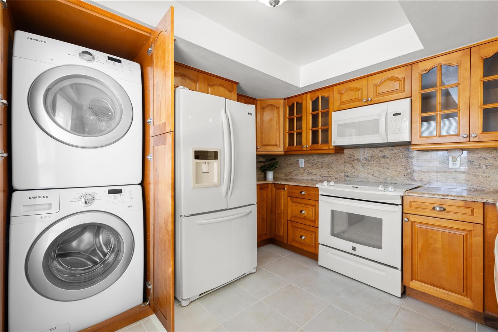 Stackable washer and dryer in kitchen