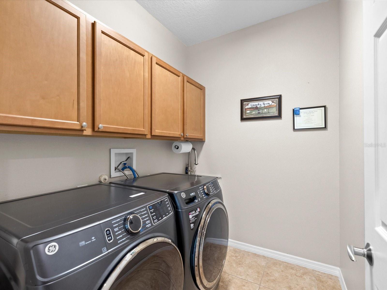 Laundry room with stainless utility sink