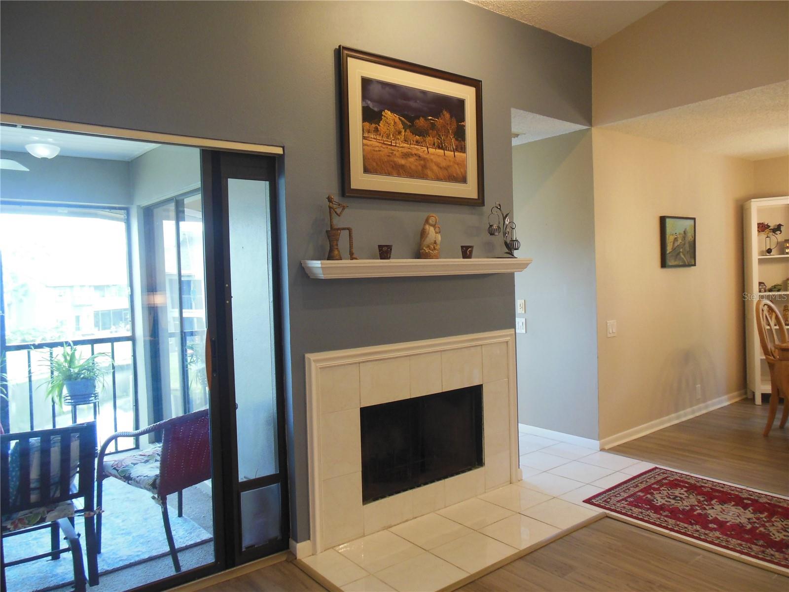 Wood burning fireplace and mantel . . .