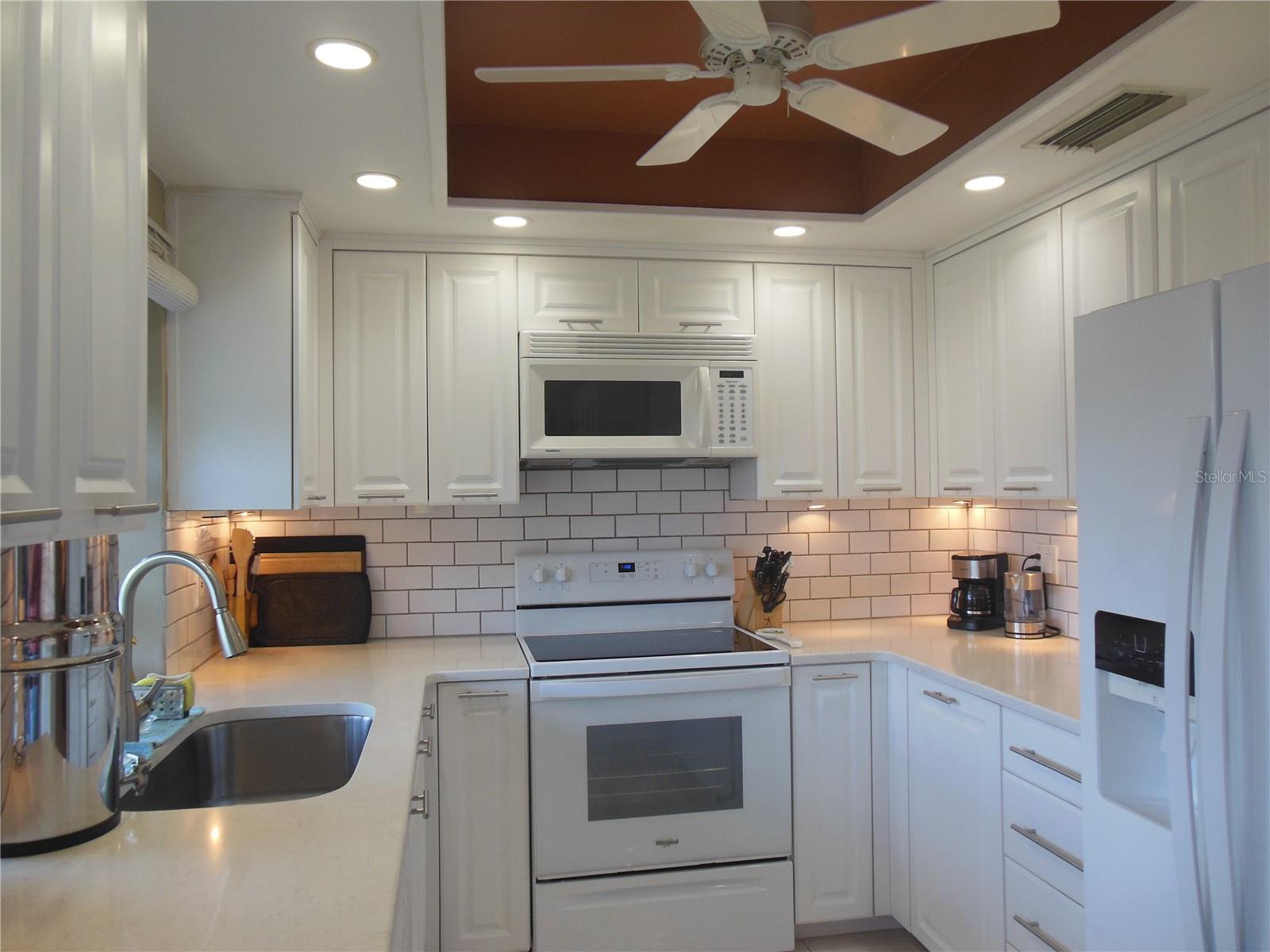 Spacious Kitchen with solid surface countertops - Green House Window . . .