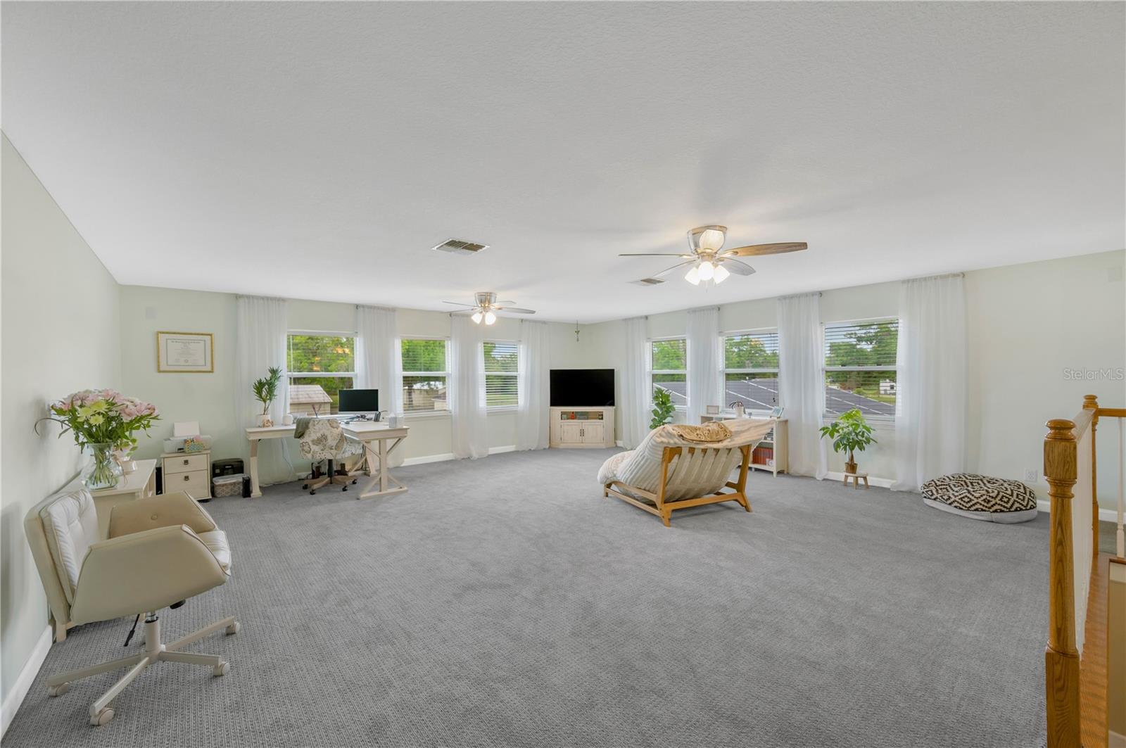 Upstairs loft/bonus room is 23' x 27' and perfect for a game room, home office, or guest retreat.