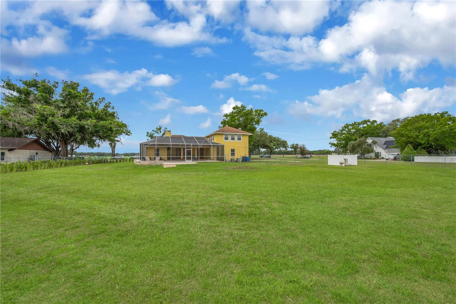 The fully fenced yard is perfect for pets to roam and enjoy and a privacy hedge was just planted.Now THIS is a backyard!