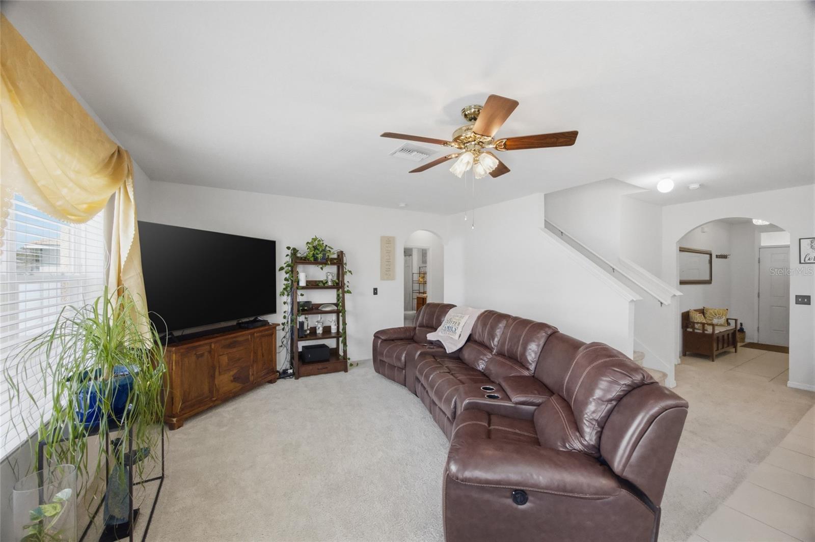 living area open to kitchen and dining areas is perfect for entertaining