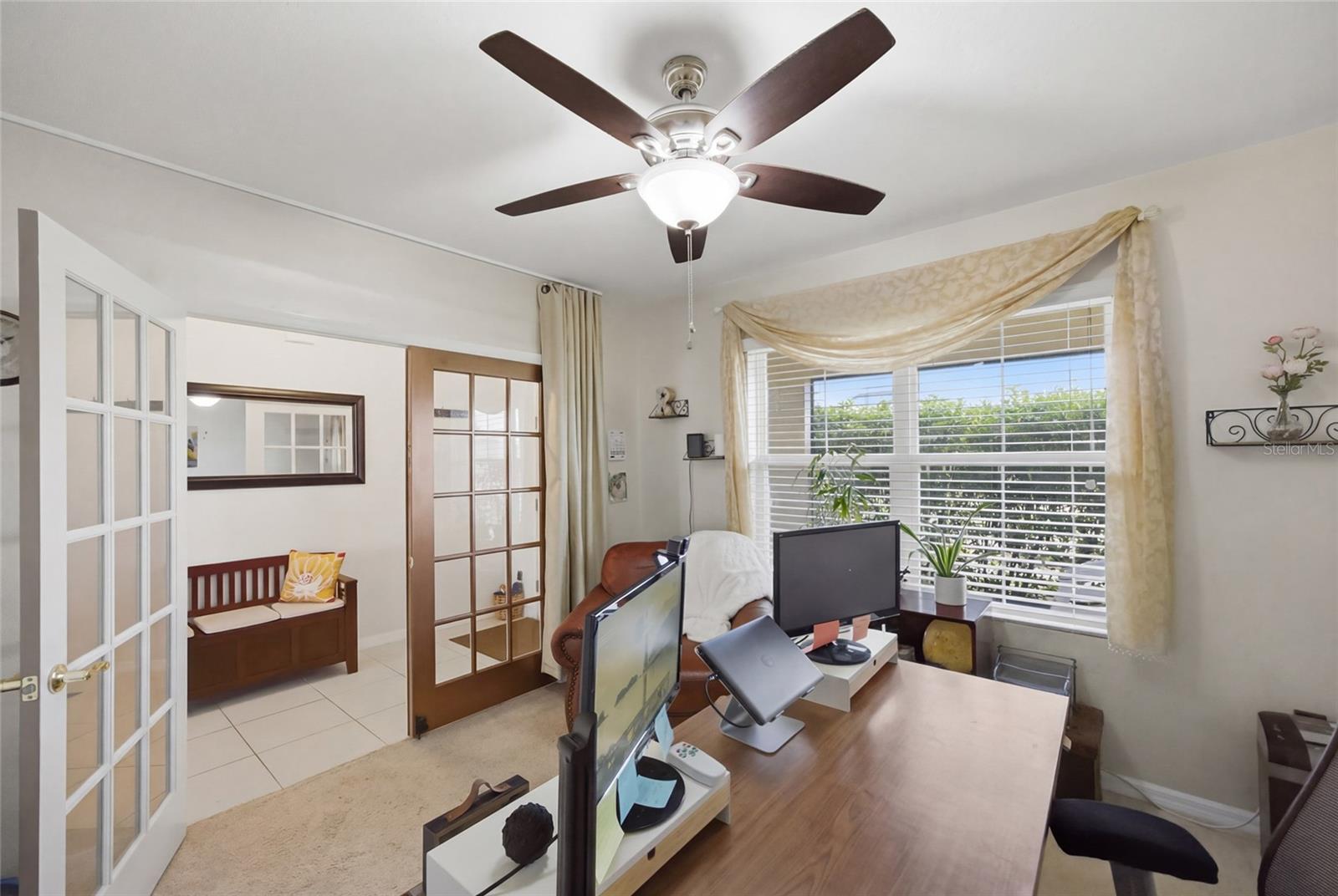 Natural light, ceiling fan & privacy doors for the perfect office environment or sitting room