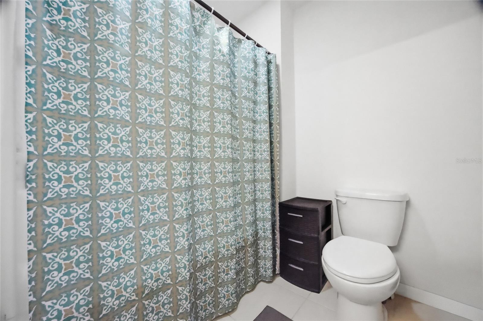 2nd floor private commode and bathing area separate from the sink area