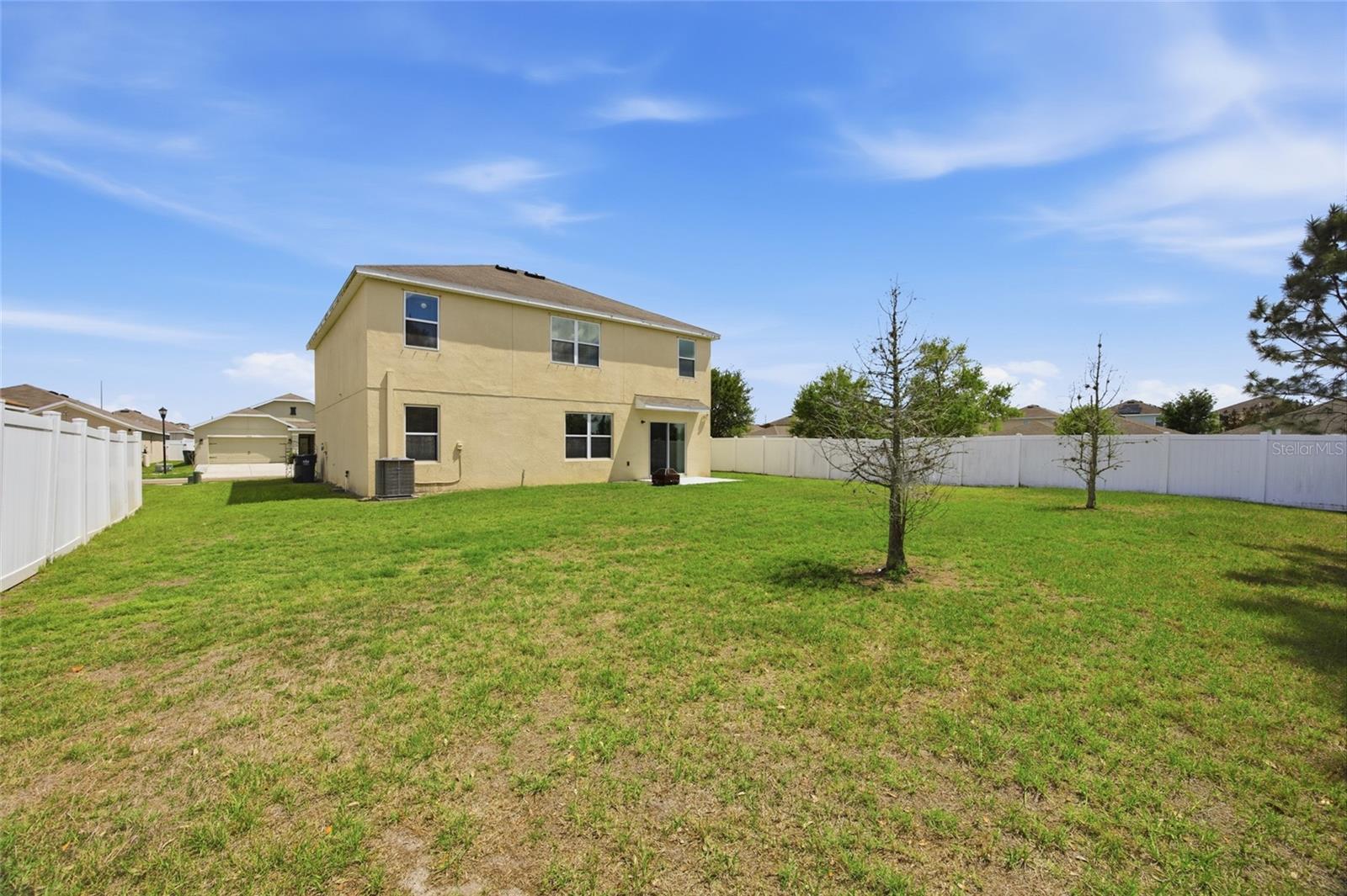 Large backyard awaiting your personal touches & maybe even a swimming pool