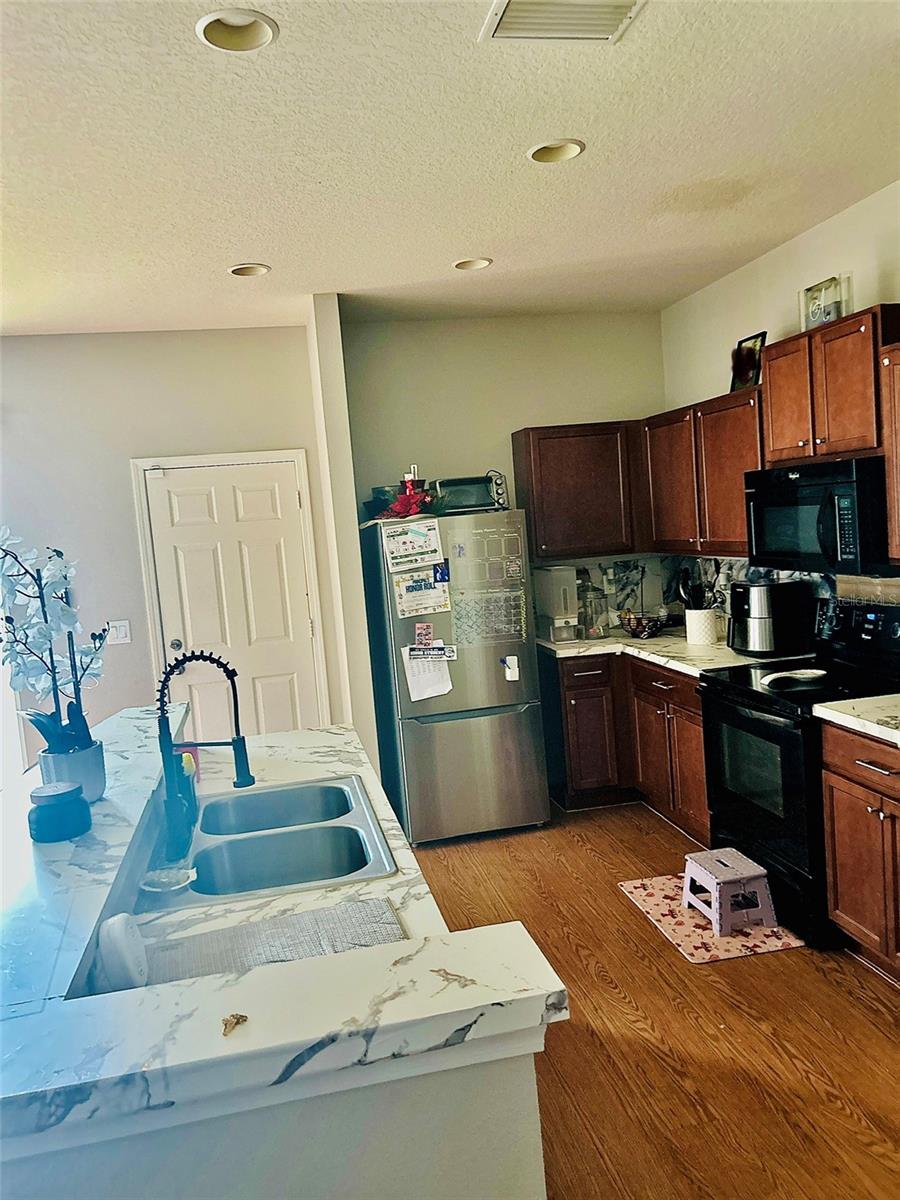 Kitchen                 (family photos blurred)