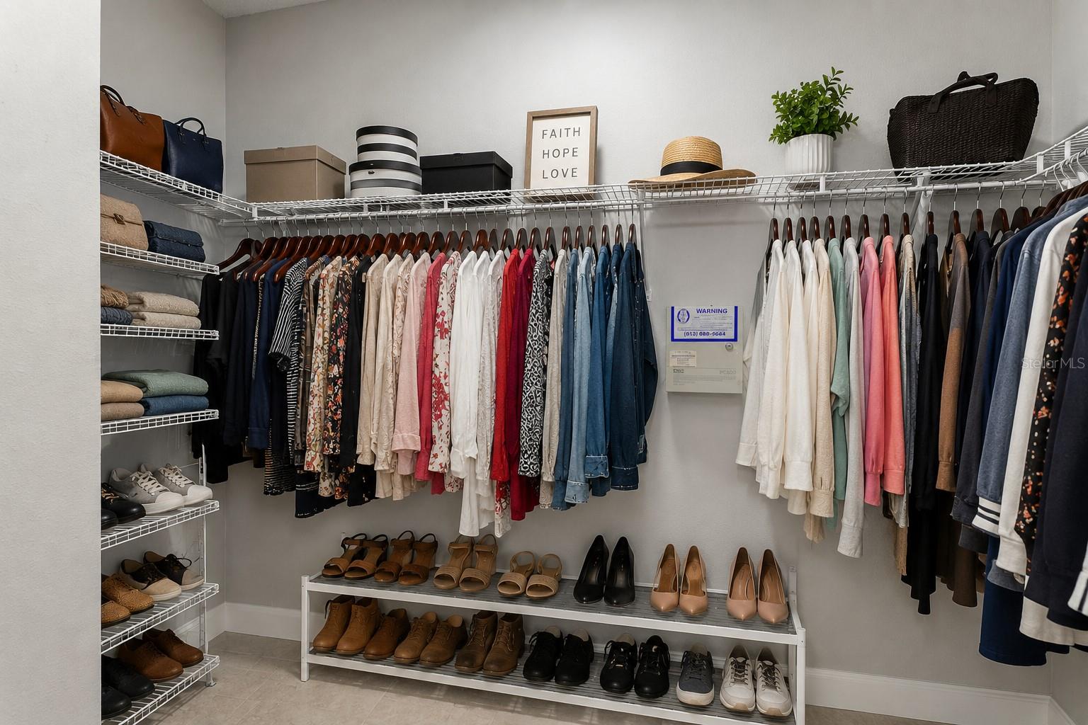 Staged Primary Bedroom Closet