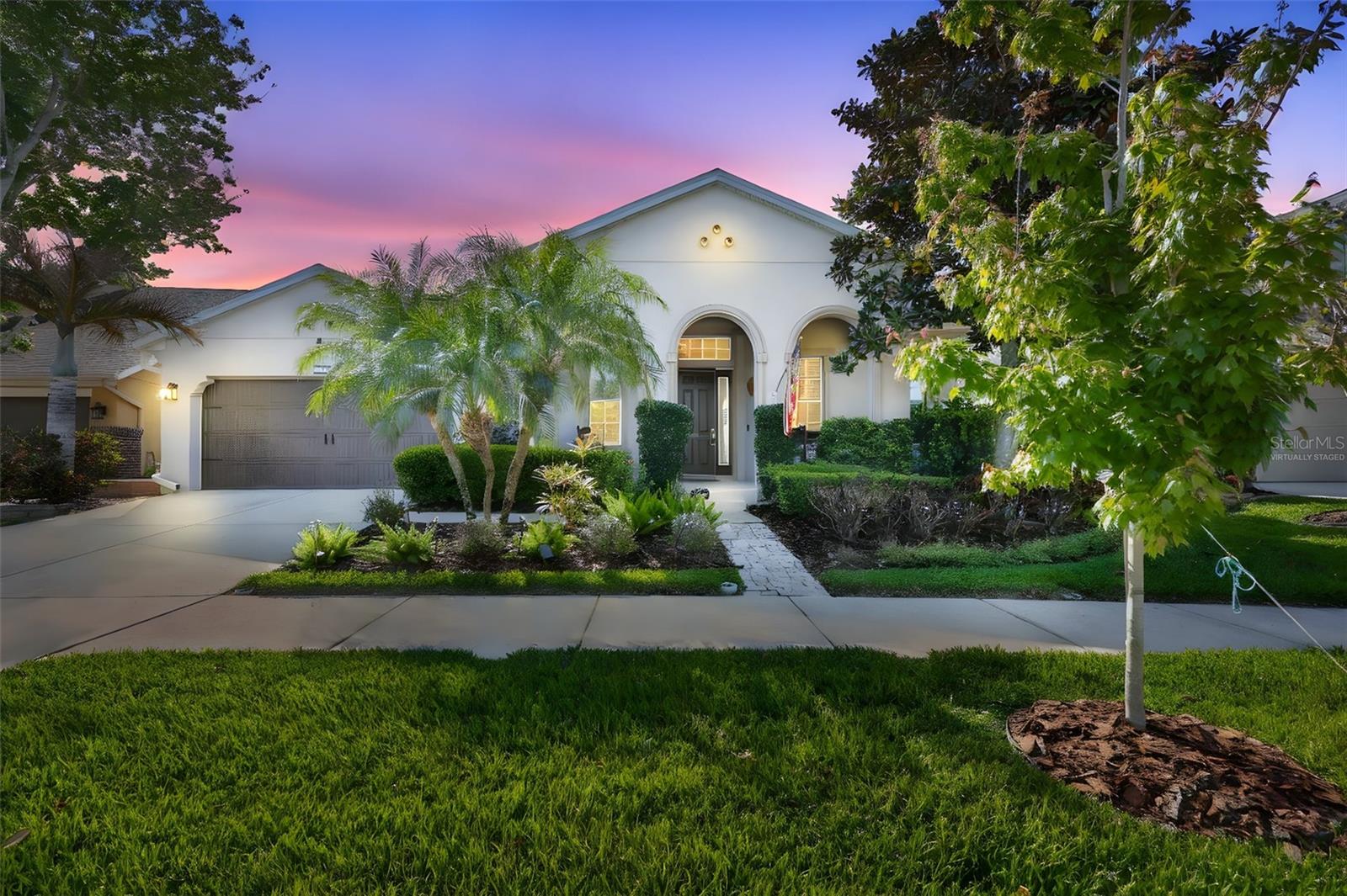 Virtually staged evening front view