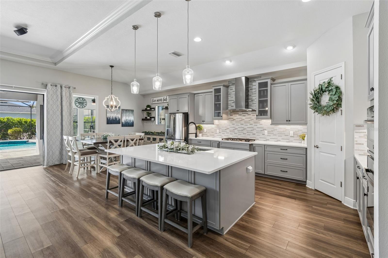 Kitchen w/ENORMOUS Island & Pendant Lights