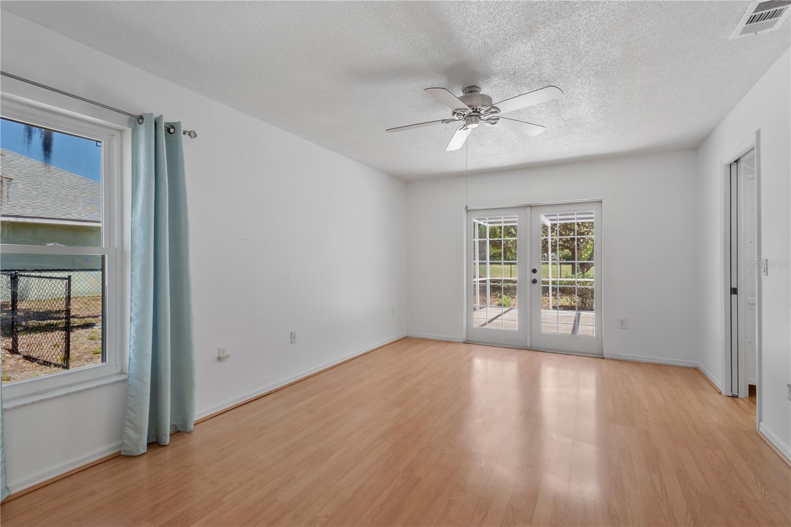 Master bedroom suite set apart from rest of residence.  Offers French doors to private side patio.