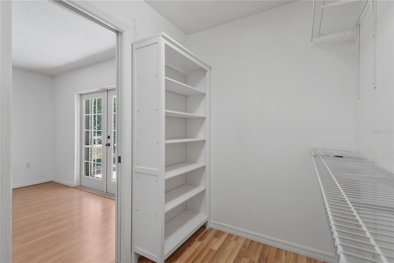 Large walk-in Master closet with organizer shelves.