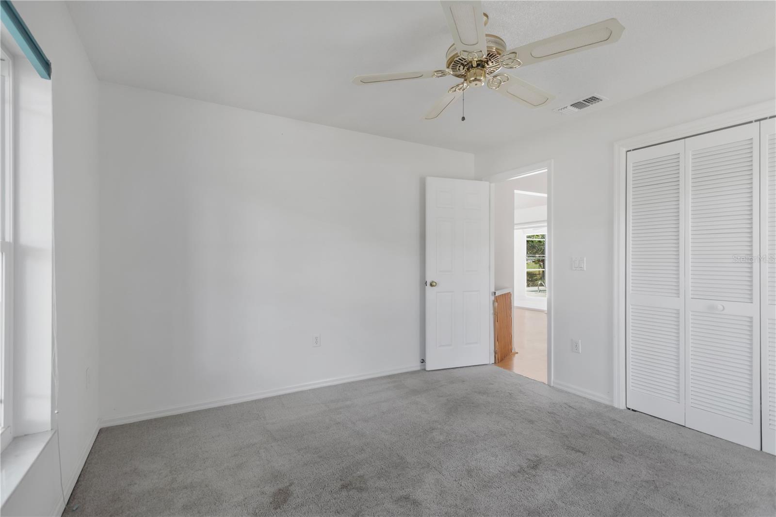 Guest Bedroom 1 is set off main living area.  Spacious in nature to appoint with large furniture, et al.