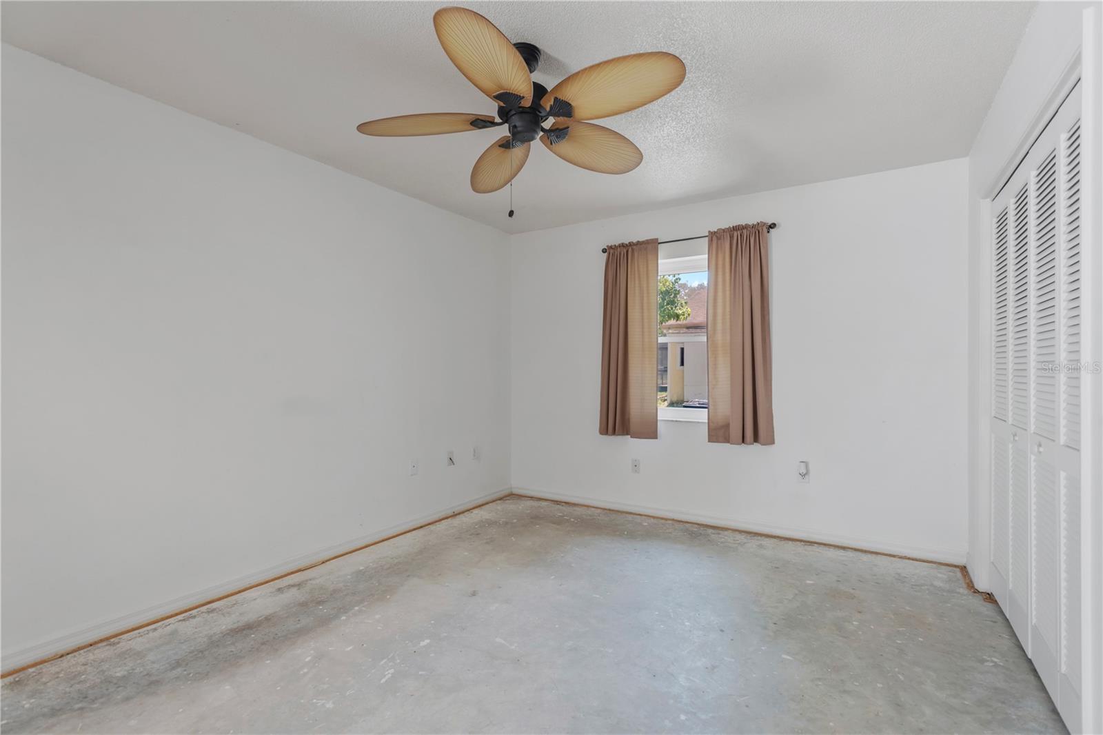 Another view of Guest Bedroom 2 features large closet.