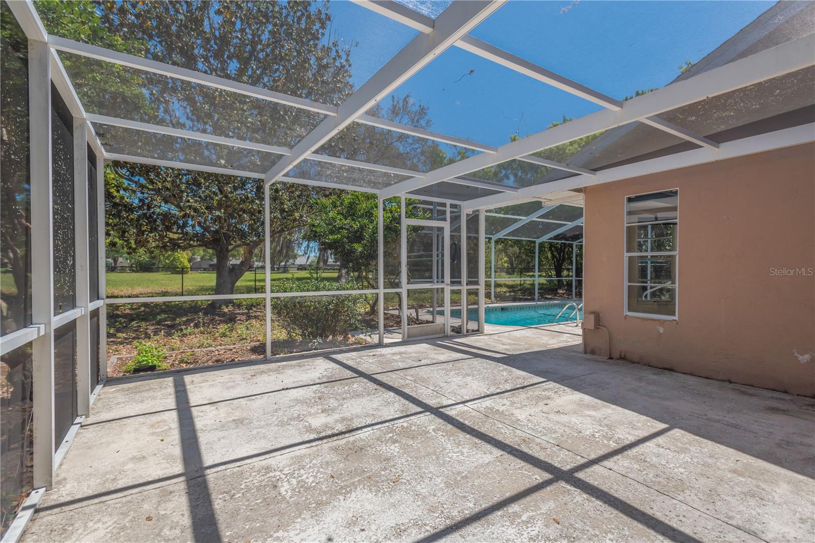 Side patio screened area that can be accessed from Master Bedroom suite.