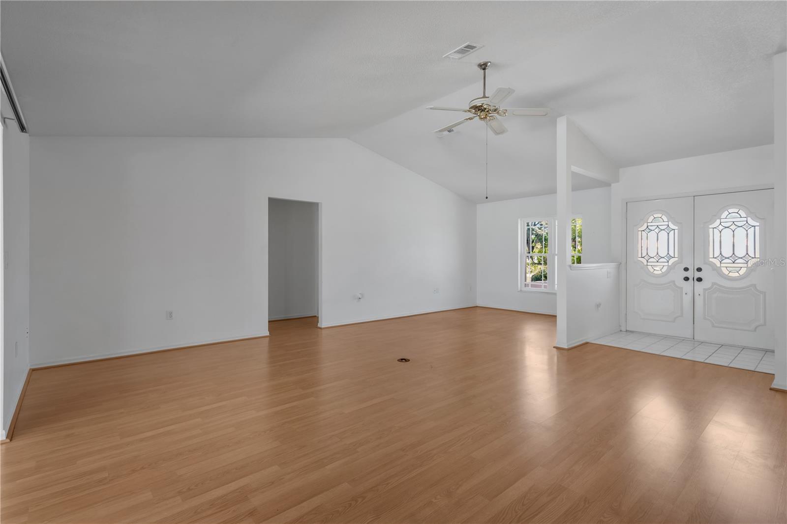 Grand entry with beautiful etched double doors welcomes you into this spacious, inviting home.