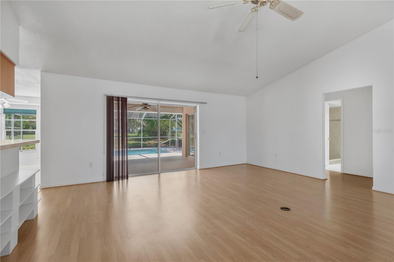 Family room with direct access to covered back patio and pool deck.