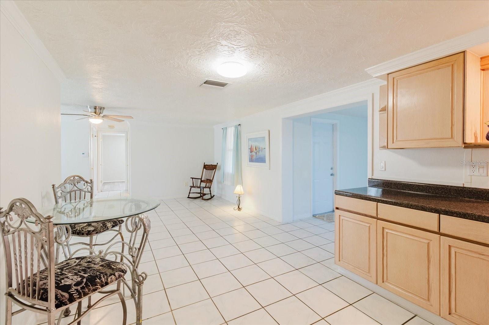 View From The Kitchen Into The Living Room In Front Of The Garage Door
