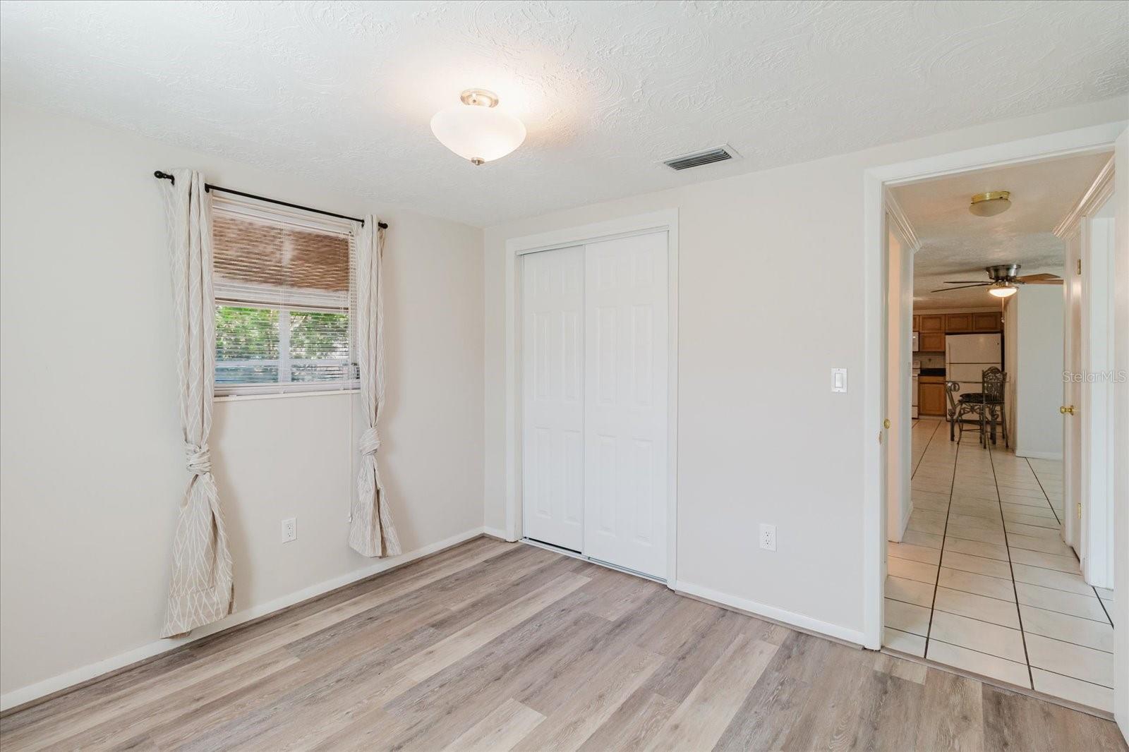 View In The Second Bedroom Of The Closet And The Bedroom Door