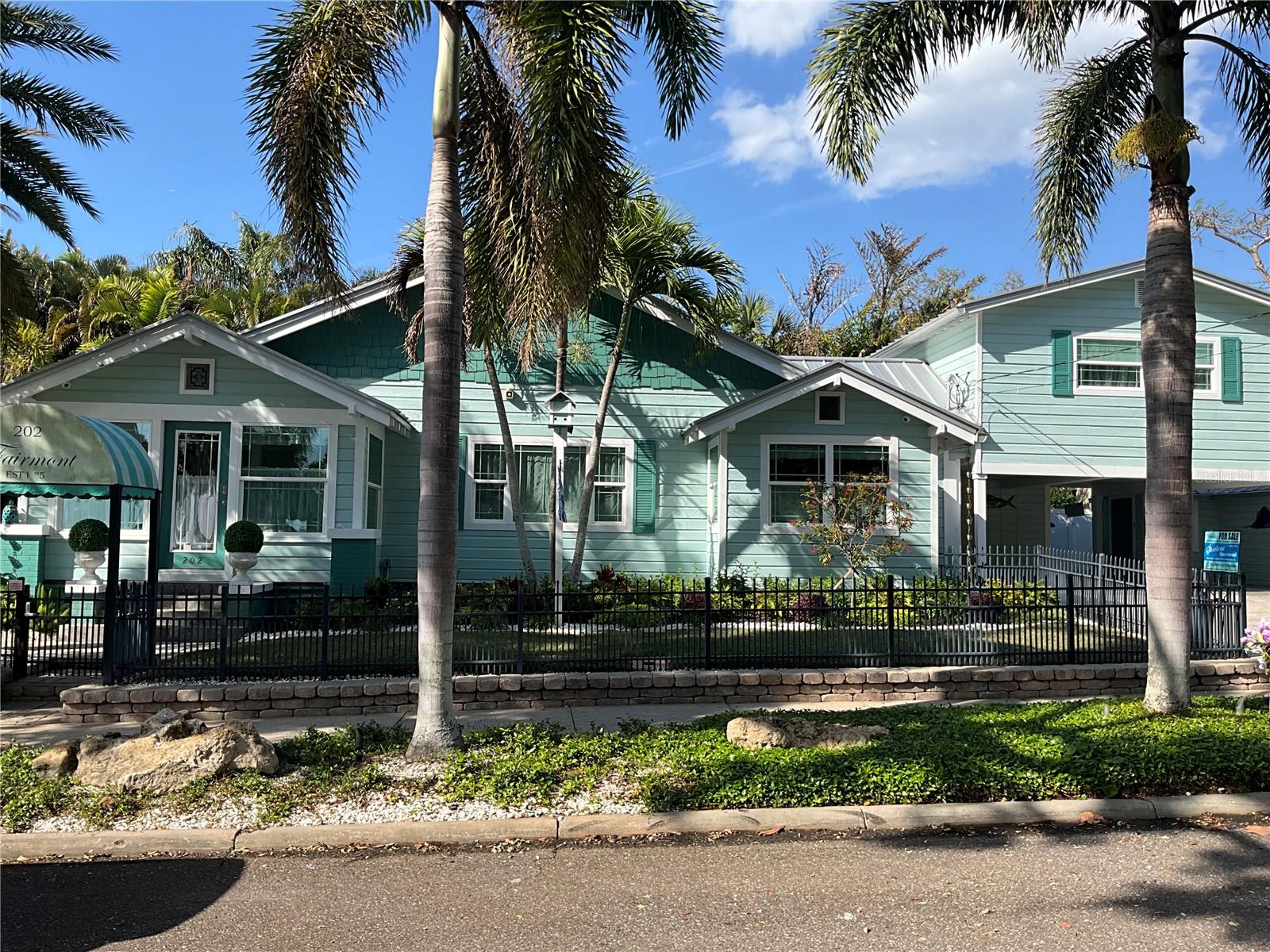 Street view, with the apartment over the carport