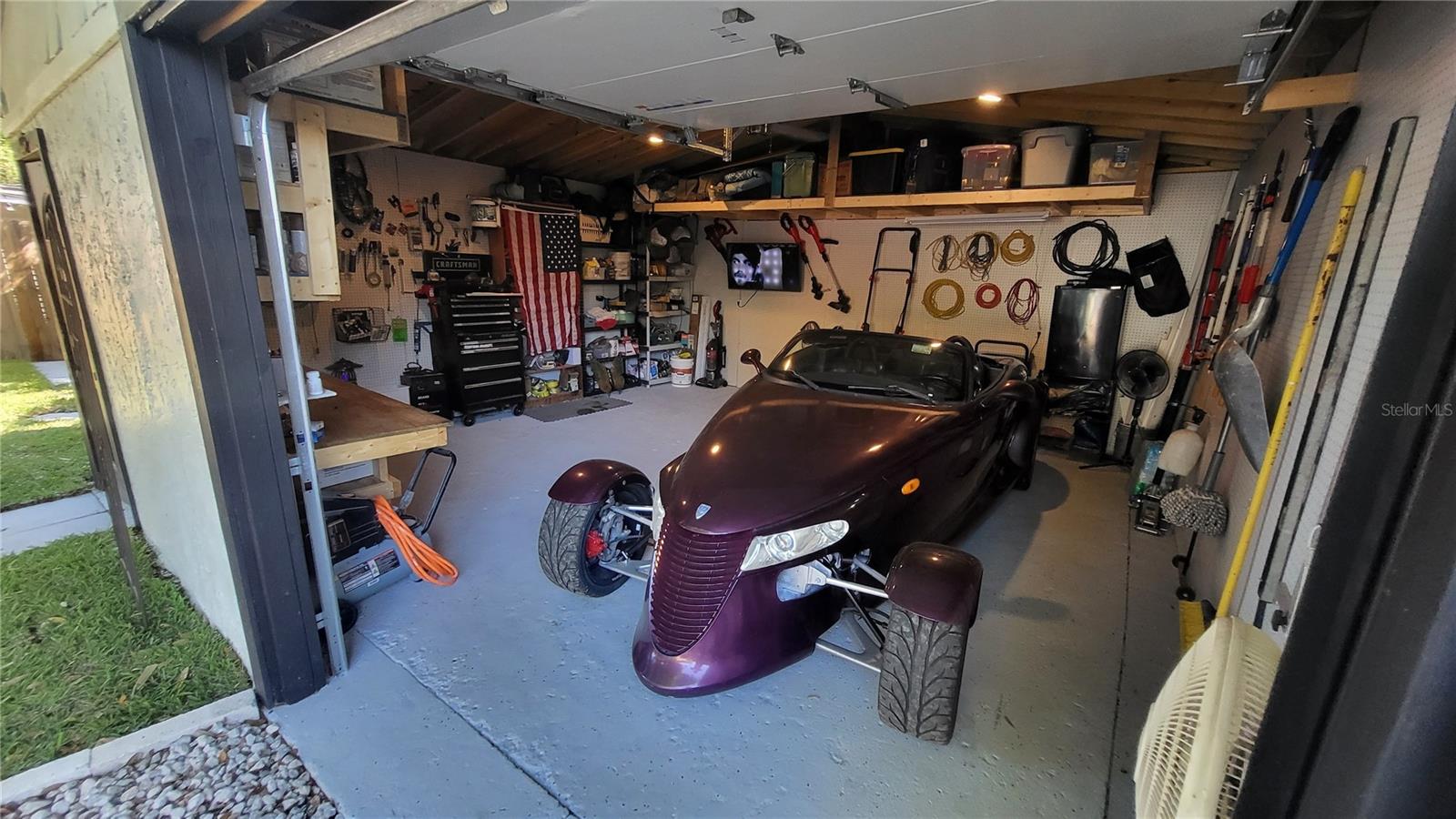 Large Garage with workshop area and overhead storage