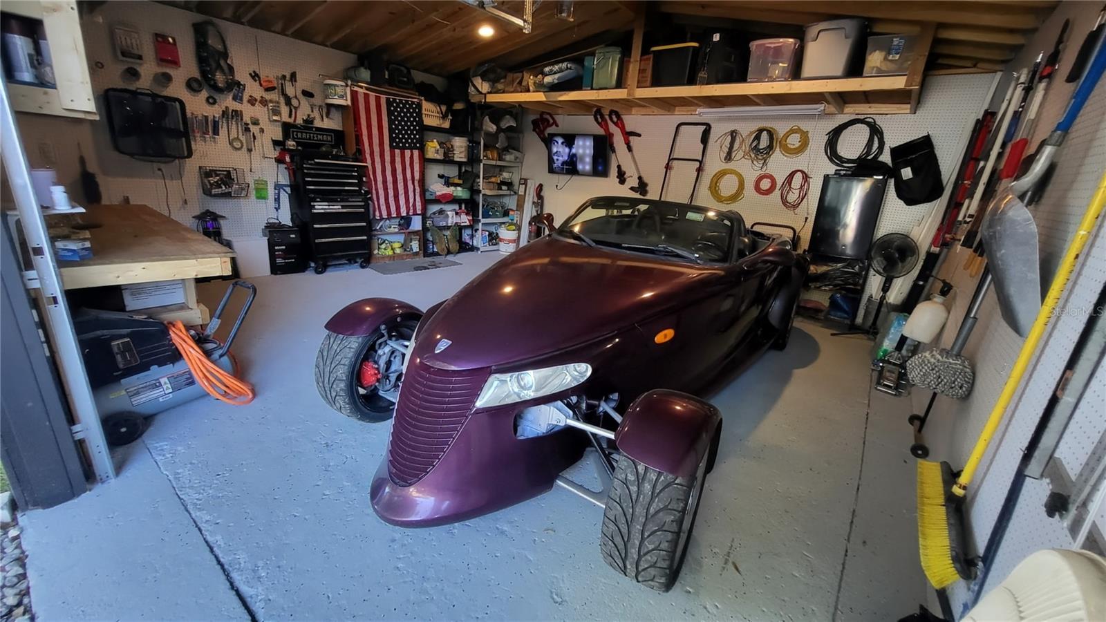 Large Garage with workshop area and overhead storage