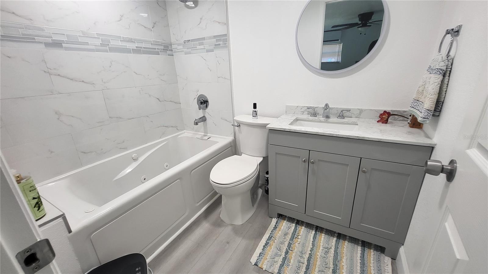 Master Bathroom featuring jetted bathtub