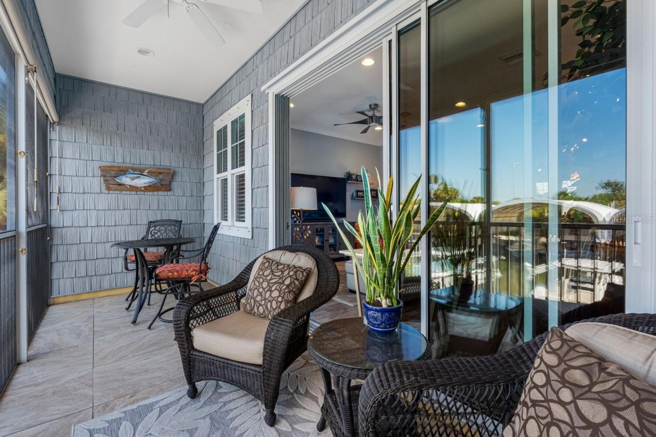 Balcony with a mounted TV and water views.  Enjoy your morning coffee while gazing out at what could be your own ?? boat sitting there waiting for you.