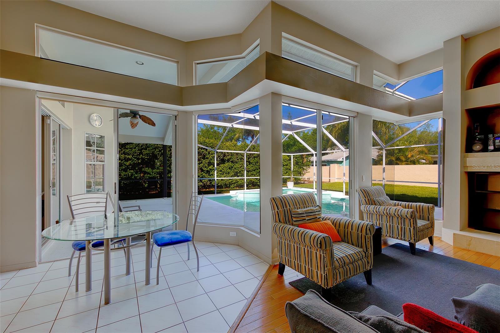 Light and bright family room with plenty of windows for natural light and dining area