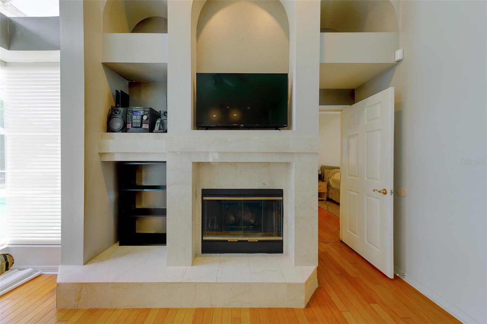 Family room with wood burning fireplace
