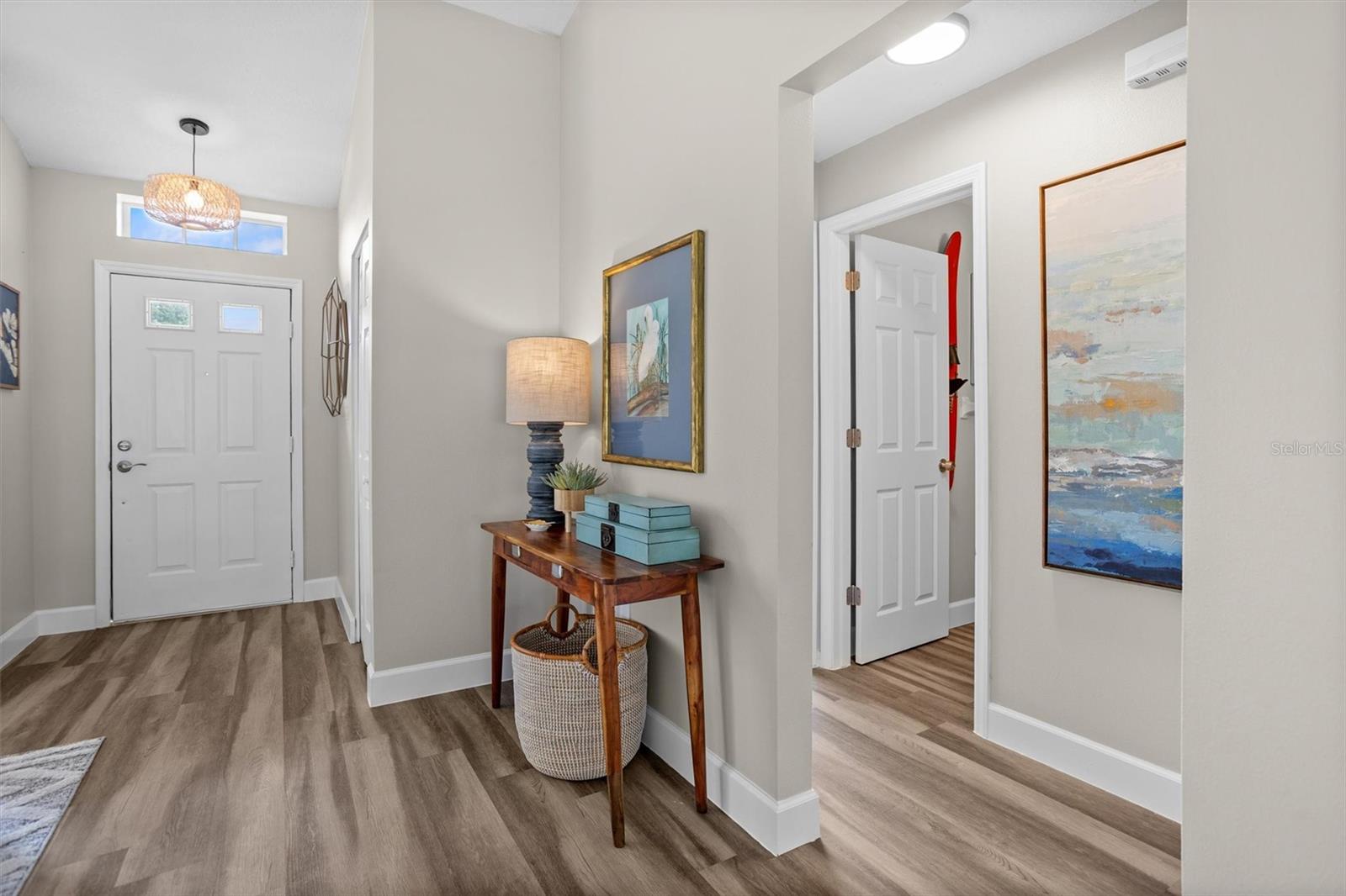 Foyer and entry to guest bed and bath