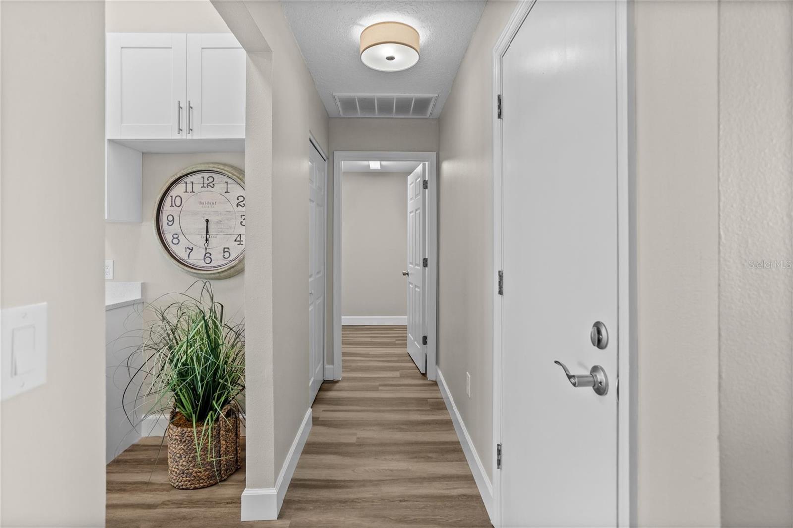 View from living area into kitchen & laundry/pantry room