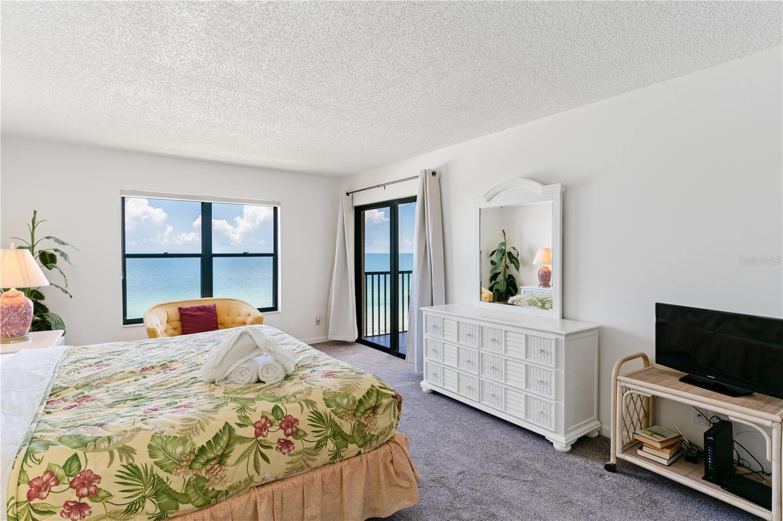 Primary Bedroom with waterview and sliders to the balcony