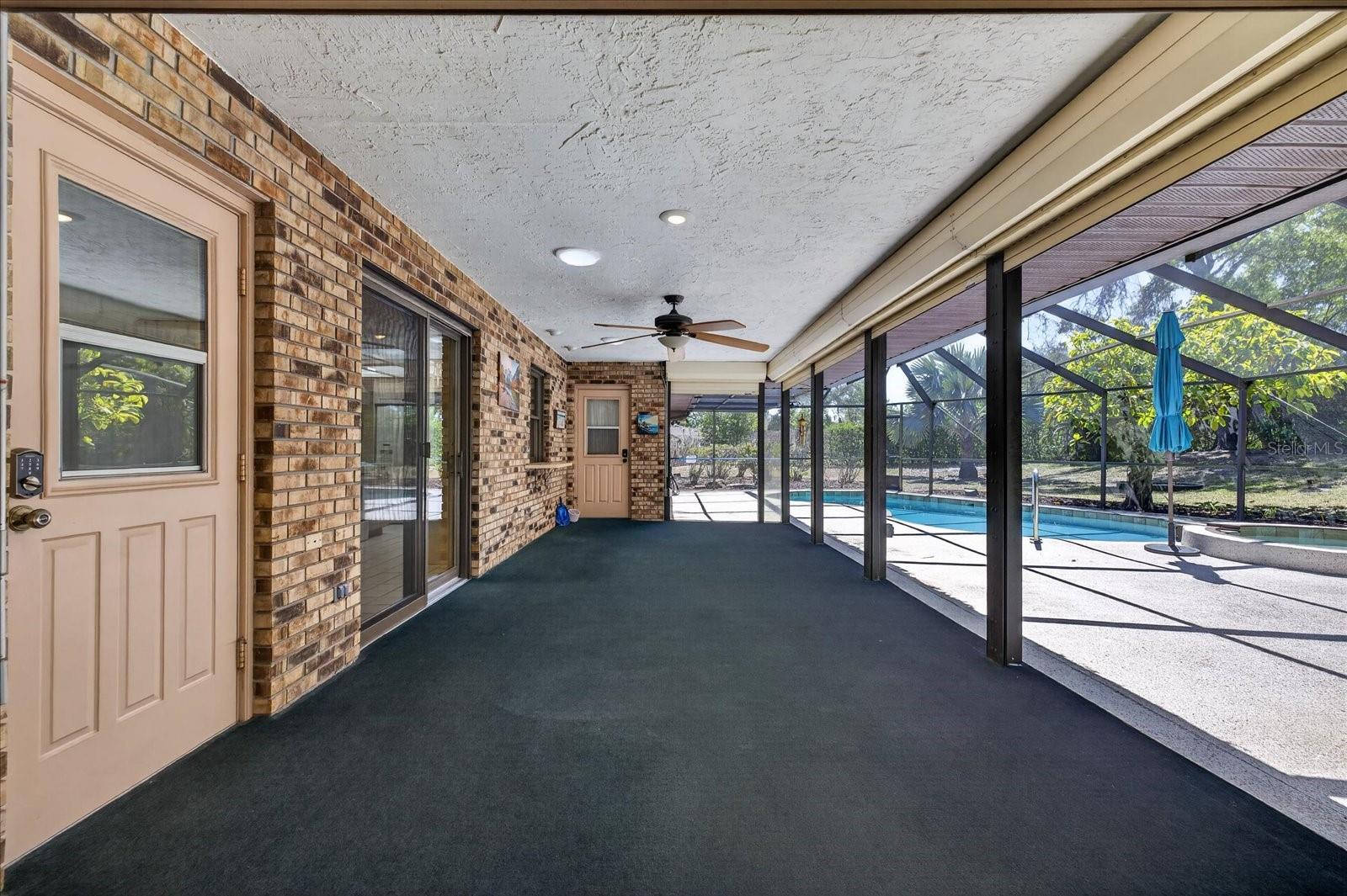 Covered rear patio with hurricane shutters