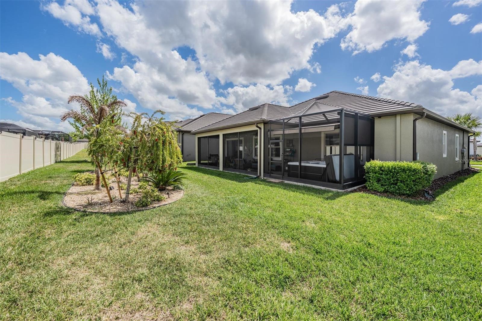 Large backyard with extra landscaping for your enjoyment!