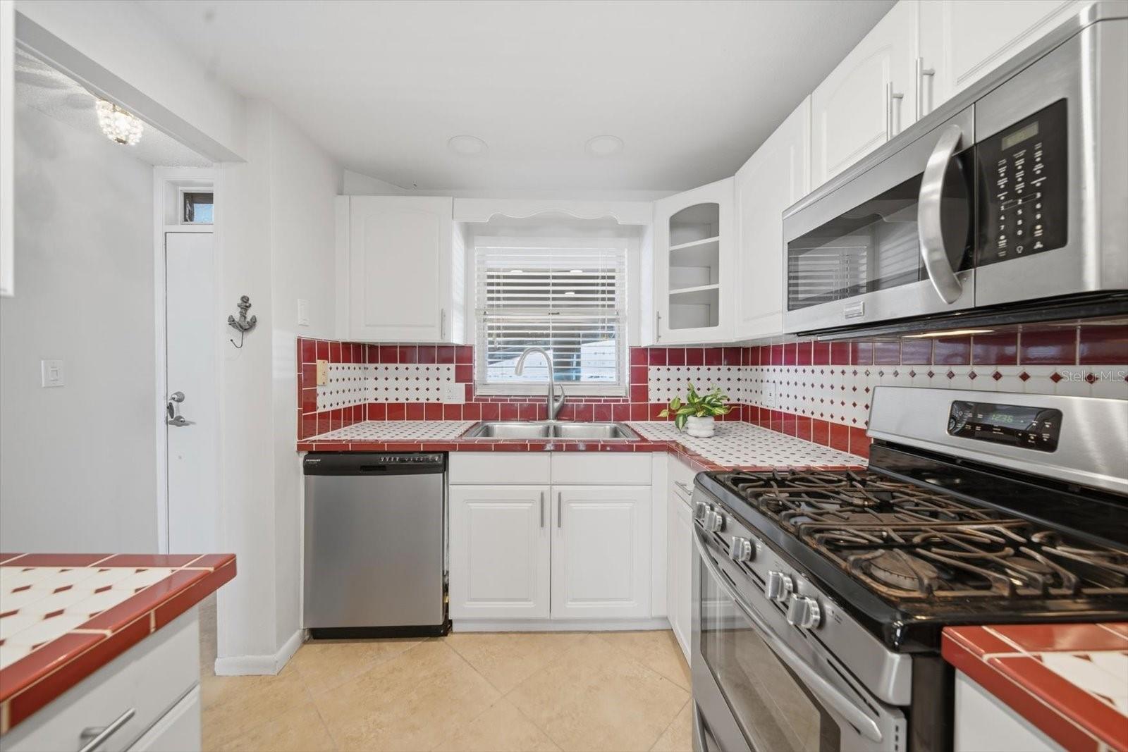 Hurricane shutters protect kitchen window.