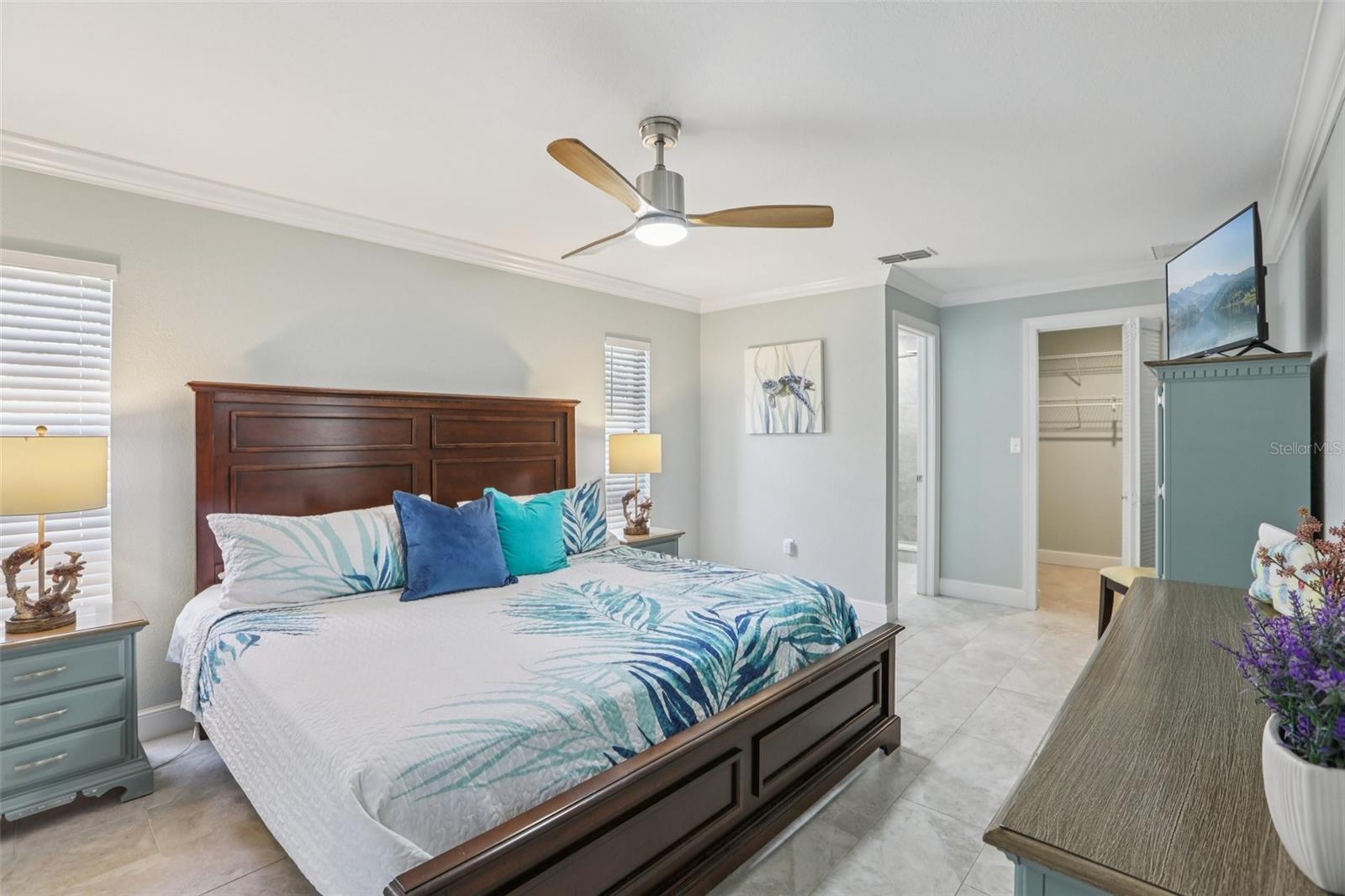 Primary bedroom with walk-in closet and ensuite bath