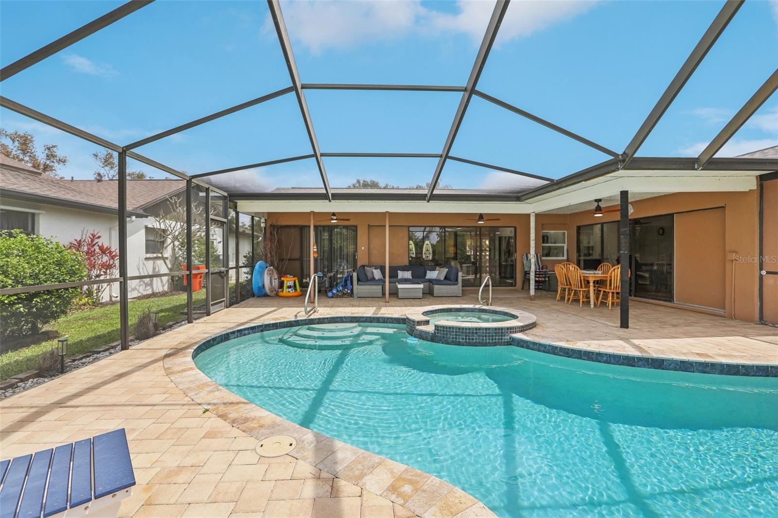 Expansive lanai and pool deck with screen enclosure
