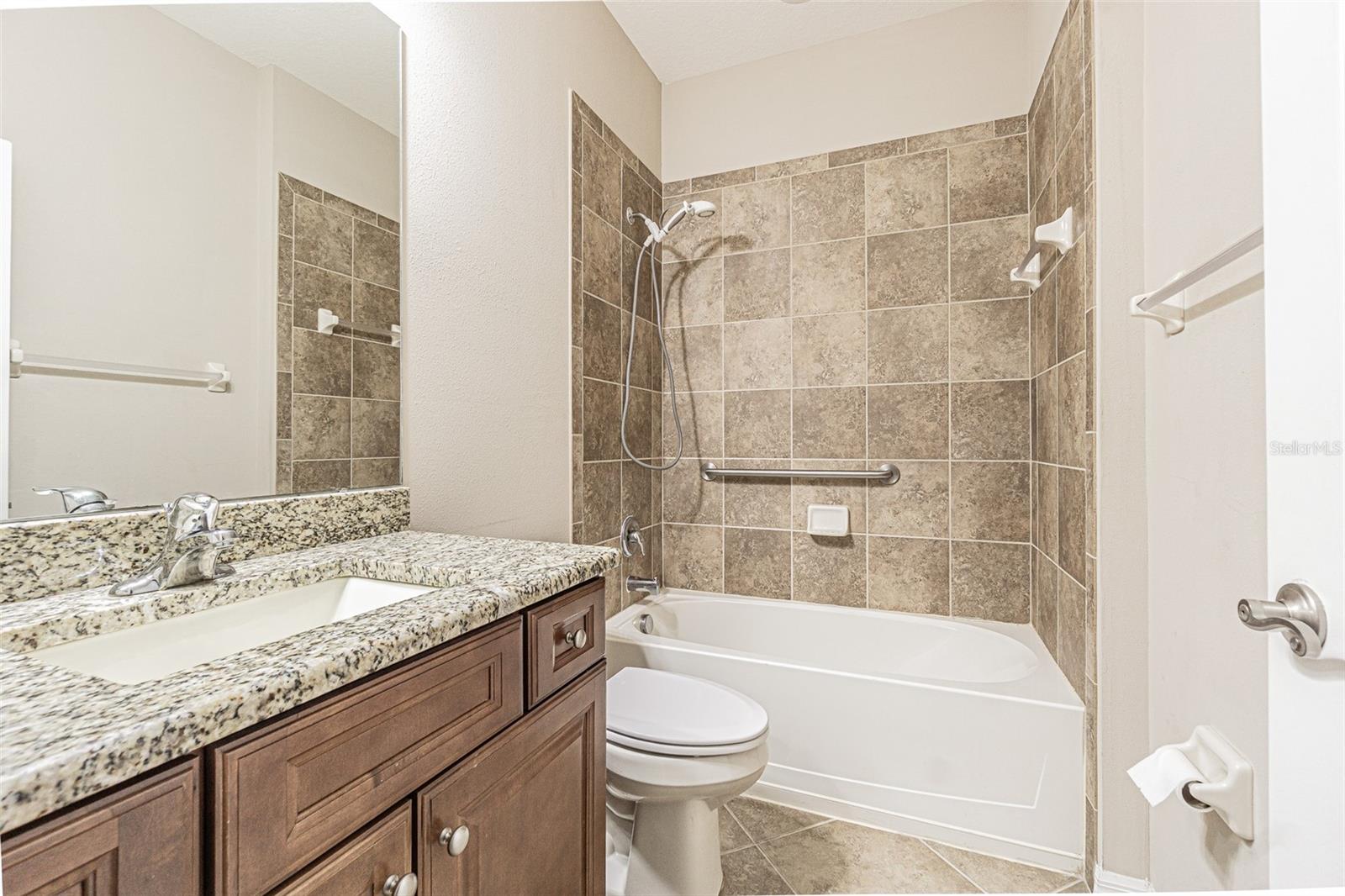 Guest bathroom with high vanity and granite.
