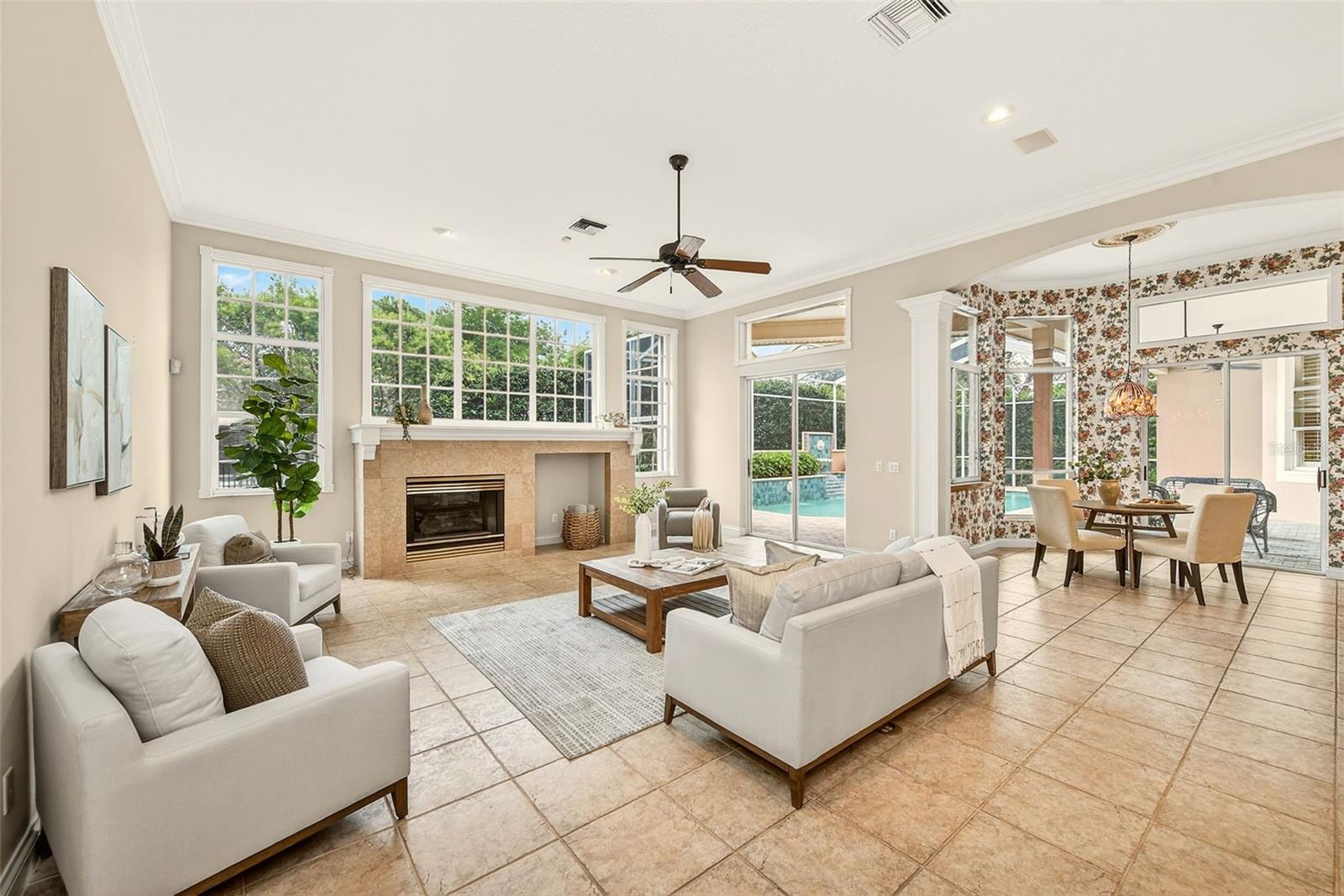 Living room with access to the pool area.