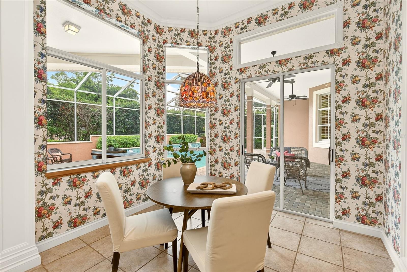 Dining area overlooking the pool and lanai.