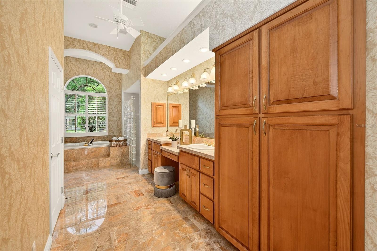 Primary bath with gorgeous marble tile.