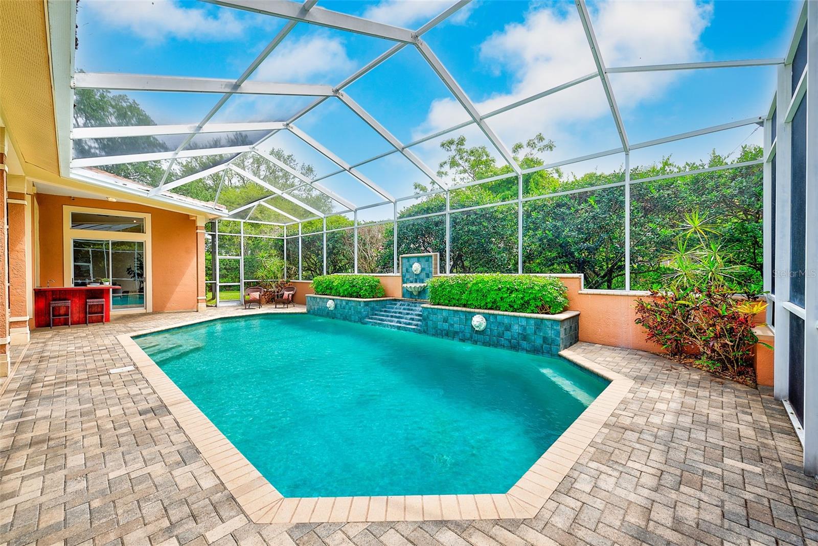 Huge, heated pool with lion head fountains.