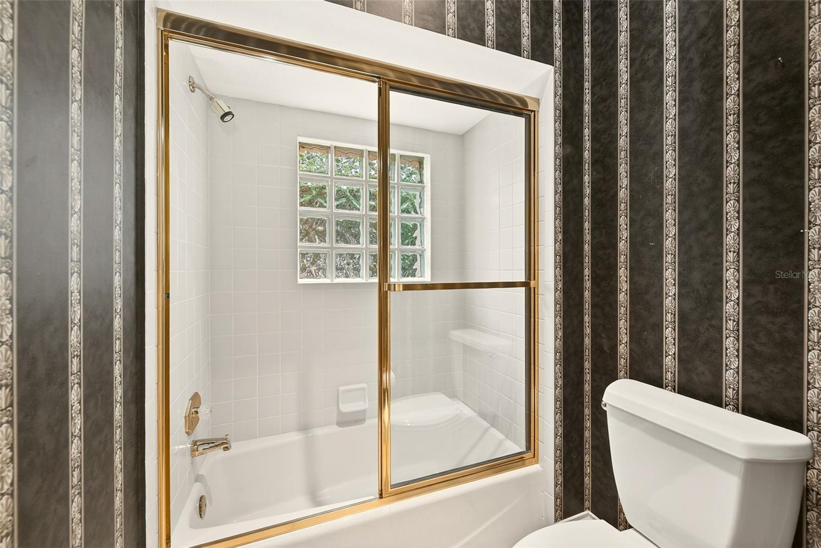 Full Bathroom shared between bedroom 3 and 4.