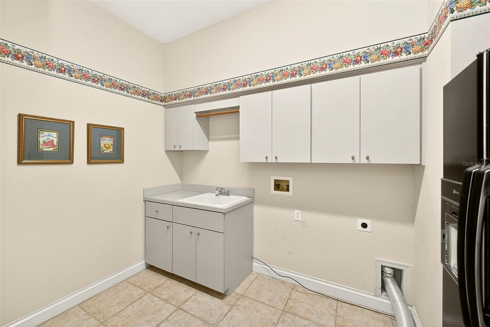 Laundry/Mud Room with 2nd fridge and tons of storage.