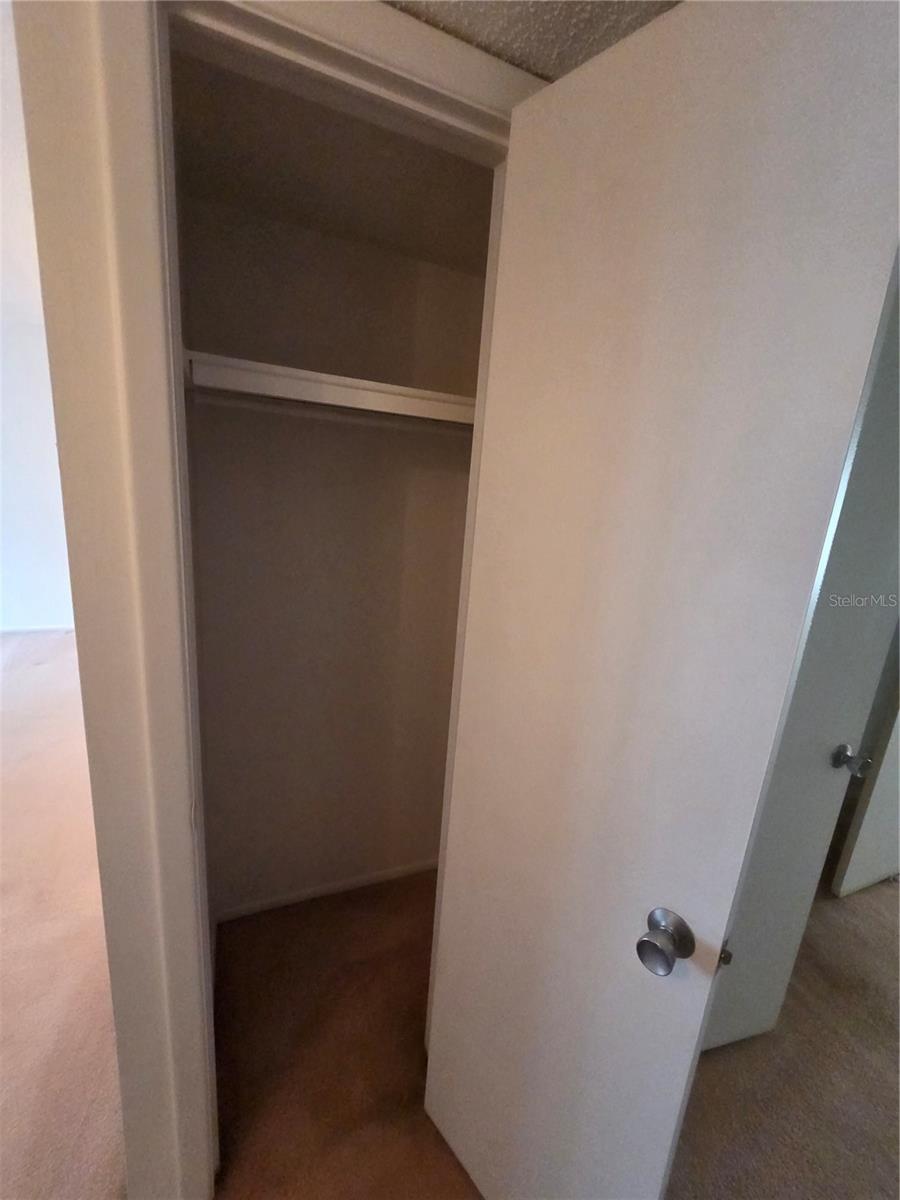 Hall closet across from bathroom