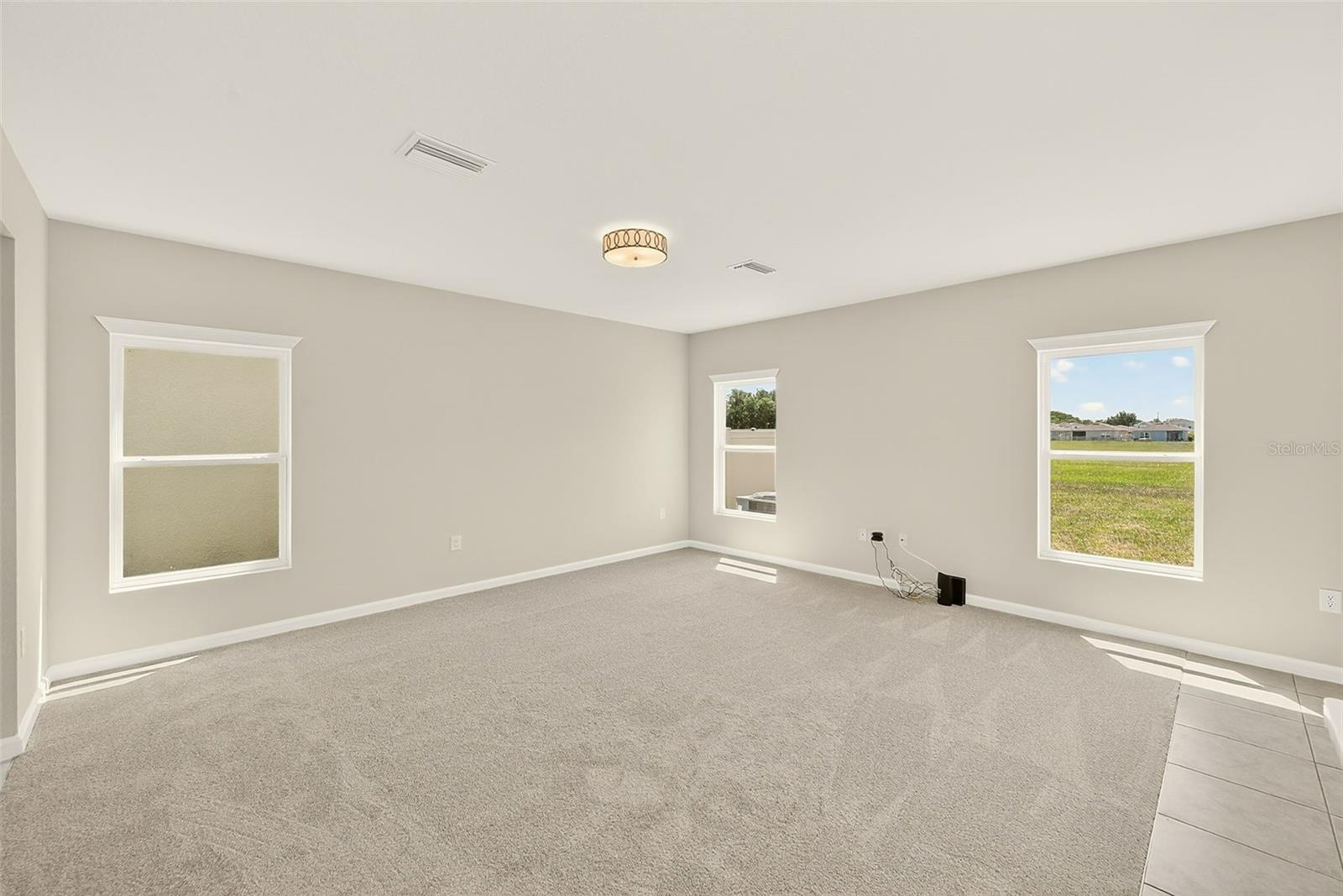 GREAT ROOM LOTS OF WINDOWS BRINGING LIGHT INSIDE