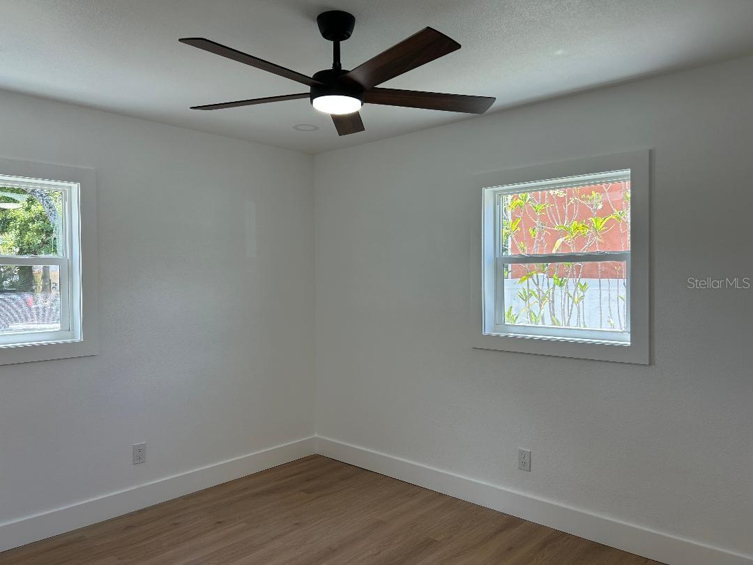 All bedrooms are bright with ceiling fans, recessed lights
